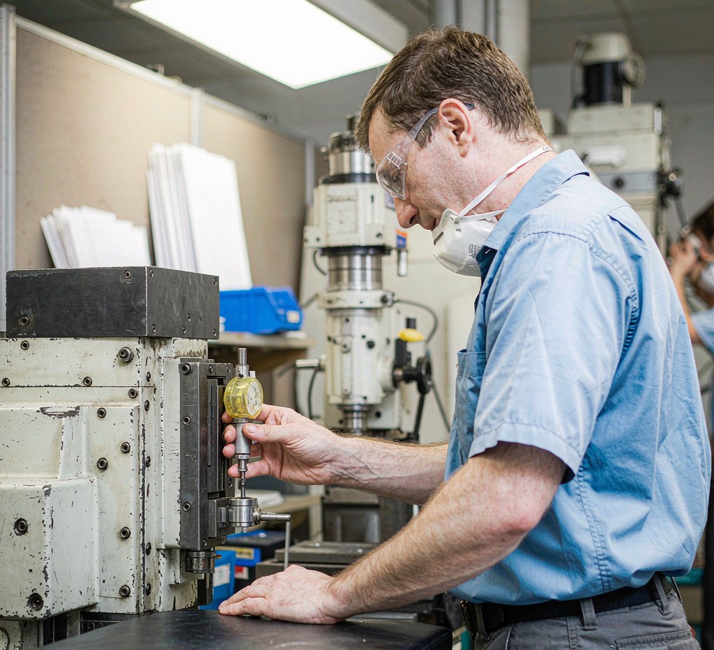 close-up of a CNC machine spindle nose and taper showing precision machined steel surfaces